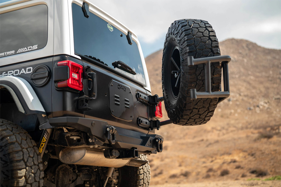 DV8 Offroad Body Mounted Tire Carrier  - JL