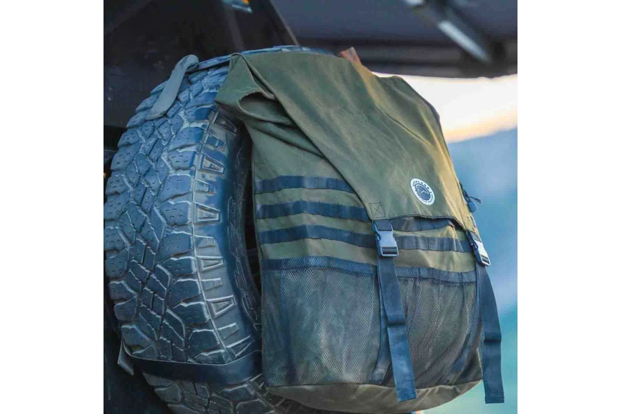 Overland Vehicle Systems Extra Large Trash Bag Tire Mount mounted to the back of a jeep